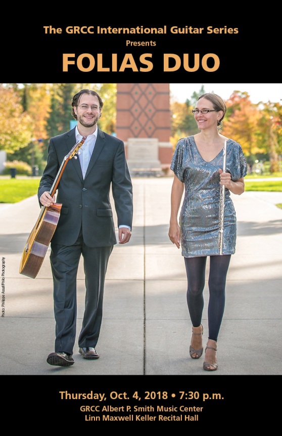 Music concert poster with a photo of a man carrying a guitar and a woman carrying a flute. The text reads: "The GRCC International Guitar Series Presents Folias Duo. Thursday, Oct. 4, 2018. 7:30 p.m. GRCC Albert P. Smith Music Center. Linn Maxwell Keller Recital Hall."