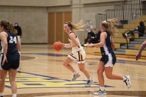 Sally Merrill playing basketball.
